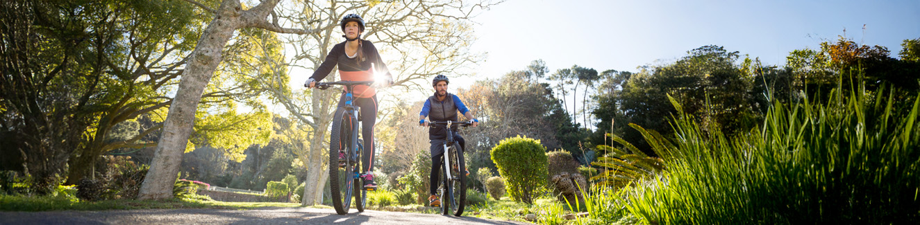 Biker couple cycling on the countryside road