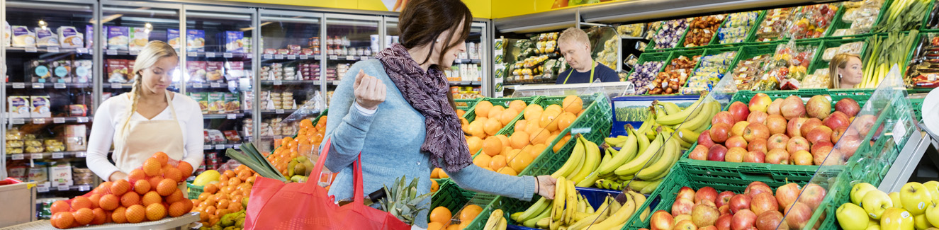 Customer Buying Fresh Bananas In Grocery Shop