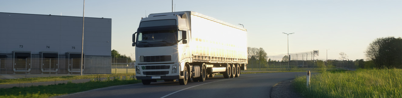 Semi Truck with Cargo Trailer Moving on a Highway