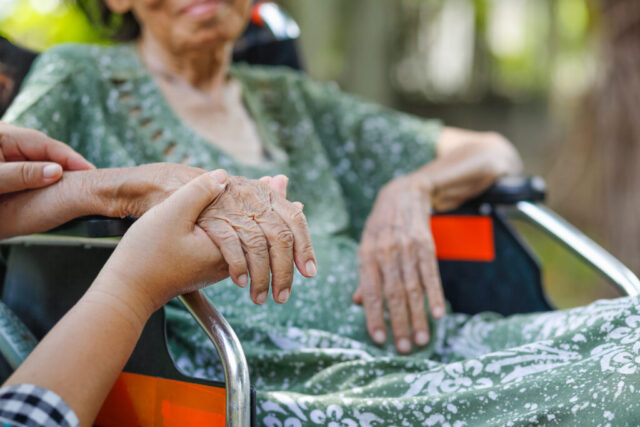 holding hand elder